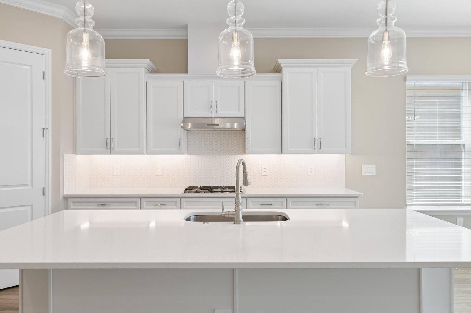 Kitchen with spacious white quartz island